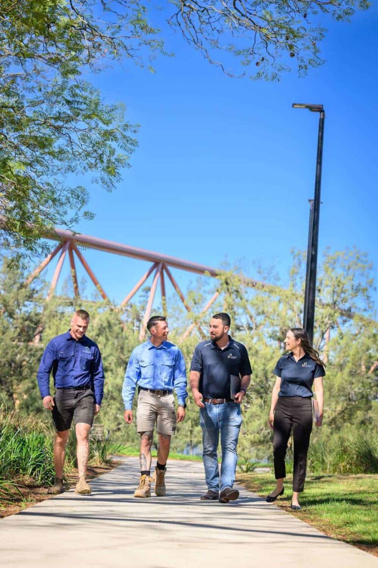 Jordan and Simone from JS Website Design walking and talking with two clients outdoors