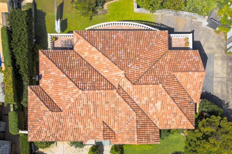 Aerial view of a complex hipped roof finished in Curvado tiles