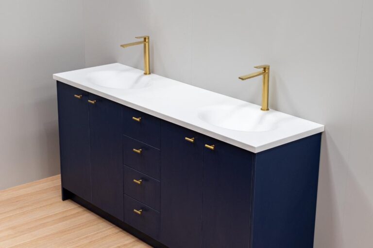 Custom navy double bathroom vanity with a white stone top