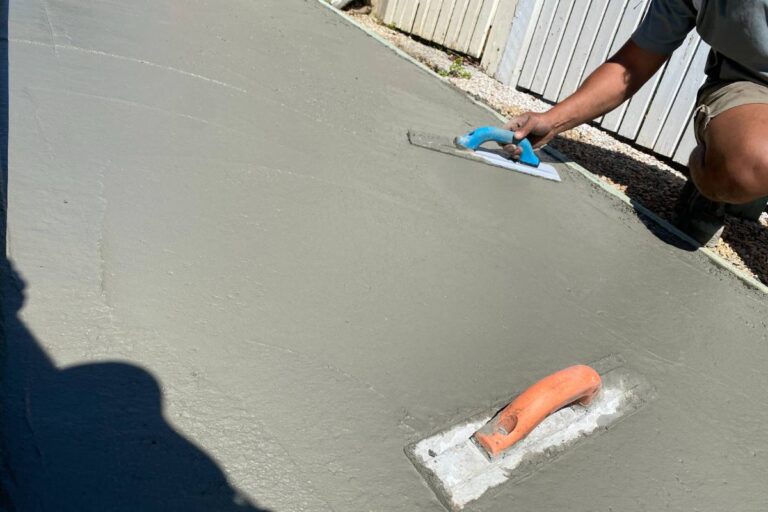 Concreter trowelling a fresh concrete surface