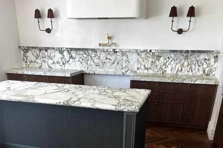 Hand painted vanity joinery beneath a marble benchtop and splashback
