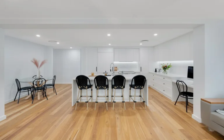 Bright renovated kitchen and dining area with an island bench