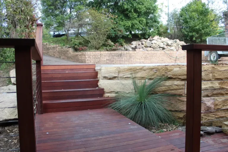 Timber steps between sandstone block retaining walls in Blaxland