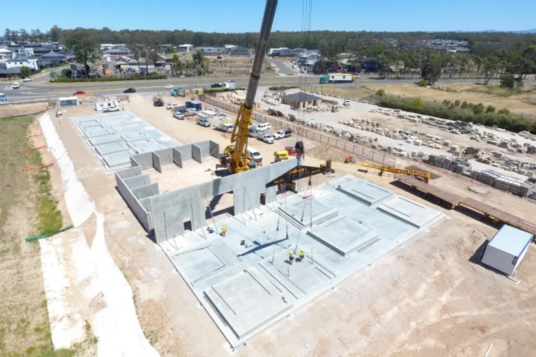 Crane lifting tilt-up panels into place at Box Hill