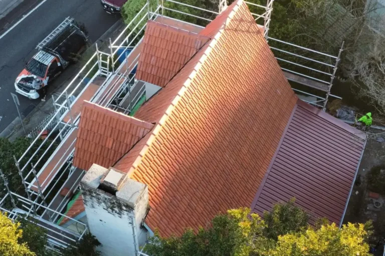 Terracotta tile reroof in progress on a home in Leura