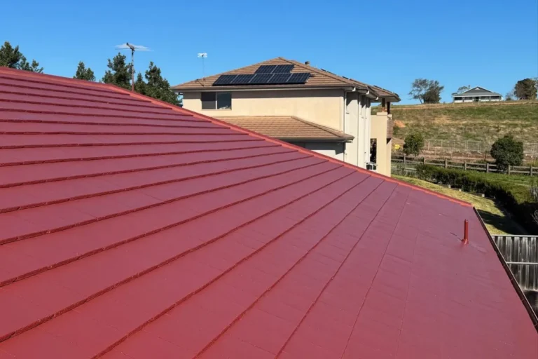 Red metal roof in Caddens restored by Roof Ranger