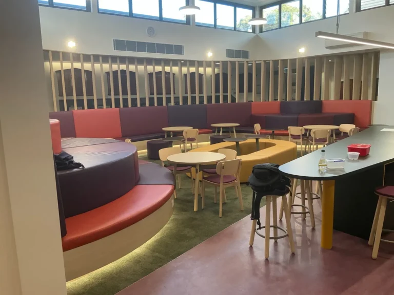 Custom booth seating and joinery in a school common room at Meriden, Strathfield