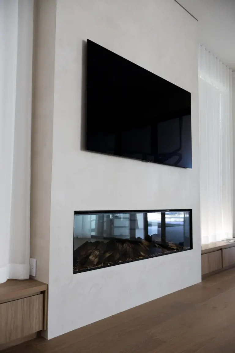Venetian plaster feature wall above a fireplace